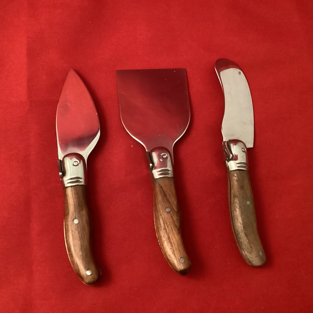Set of three small cheese knives with wood handle